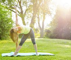 The 10 best beginner yoga poses for men. Female Fitness Instructor Doing Yoga Extended Triangle Pose Outdoors In Morning Sunshine Stock Photo Picture And Royalty Free Image Image 20638288