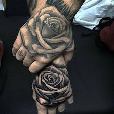 This rose sits on the front of the shoulder, and it's in bright red. 155 Rose Tattoos Everything You Should Know With Meanings 1000 Tattoo Photo Eddnet