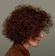 This short, fun haircut gives your strands body at the front and gradually gets shorter at the back and on the sides for a trendy alternative to the traditional pixie. How To Care For And Style Men S Curly Hair At Length By Prose Hair