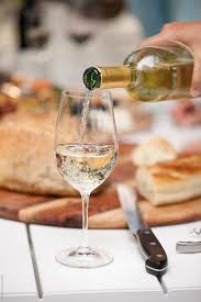 Chicken pot pie with dry sparkling wine. White Wine Pour At Dinner Party By Jill Chen