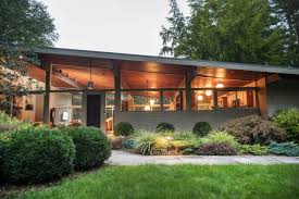 Exterior, house building type, brick siding material, stone siding material, and concrete siding material. The Angled Roof Of The Post And Beam Construction Modernhomedesigns Mid Century Modern Exterior Mid Century Modern House Modern Exterior