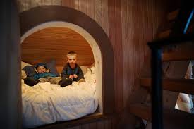 Hidden bookcase door secret room. Kid Spaces In Home Slides Secret Rooms And Other Creative Touches Prompt Indoor Fun
