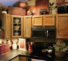 The cabinet would've appeared huge and the things on top would have looked crowded. 38 Decorating Cabinet Tops Ideas Above Kitchen Cabinets Decorating Above Kitchen Cabinets Kitchen Cabinets Decor