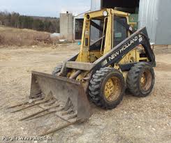 From inside the cab, you can lock and unlock the . 1988 New Holland L555 Skid Steer In New Haven Mo Item Db6287 Sold Purple Wave