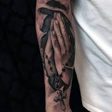 Two hands with prayer in cross and pigeons flying. Top 63 Praying Hands Tattoo Ideas 2021 Inspiration Guide