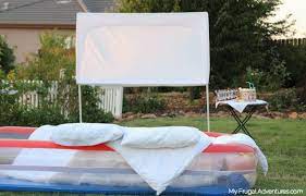 Loch and key productions borrow the shepherd's hooks from your hanging plants to use for the outdoor movie screen. How To Build An Outdoor Movie Screen My Frugal Adventures