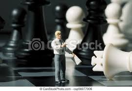 Chess is becoming more interesting after some years of playing when you will finally understand the true spirit of this wonderful game. Businessman And Chess Figures On Game Board Playing Chess With Miniature Doll Macro Photo Man Explains Chess Game Rules Canstock