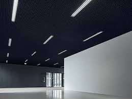The project involves installing a grid system and placing ceiling tiles into the openings. Metal Ceilings Durlum Gmbh
