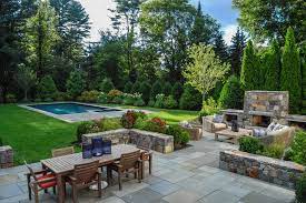 Adding an outdoor kitchen to your existing patio means that you can dine outdoors whenever you want. A Blade Of Grass Boston Landscape Design Installation Maintenance