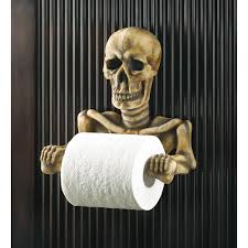 This Bony Fellowa S Grinning Every Time The Papera S Spinning Spooky Toilet Paper Holder Is A Most Une Halloween Bathroom Skull Decor Halloween Toilet Paper