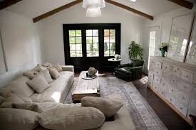 Natural light and gentle breezes flow through the many french doors and windows located to accommodate not only the garden views, but the prevailing sun and wind as well. Contemporary White Living Room With Black French Doors Hgtv