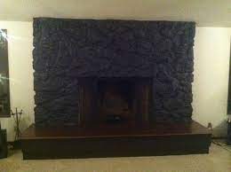 The crumbling porous rocks and general ugliness was practically screaming for a makeover. Behr S Cracked Pepper Painted Over Lava Rock Lava Rock Fireplace Rock Fireplaces Fireplace Makeover