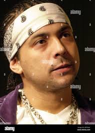 Jamaican dancehall reggae artist Sean Paul Henriques looks over his new  custom jewelry during an interview in New York, March 24, 2003. Paul is  being hailed as a crossover sensation, the man