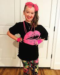 Dancing through the Decades” end-of-the-year party at school for the last  day of class. It was fun telling Eva about all of my favorite fads from my  childhood and getting her ready