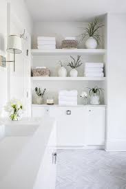 This style of granite countertop is more suitable for bathrooms, as opposed to darker granite you may find in the kitchen. White Bathroom Cabinets Design Ideas
