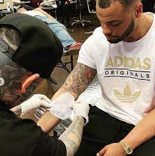 Dak's inner part of right bicep 'sailboat' tattoo tattoo: Dak Prescott S 15 Tattoos Their Meanings Body Art Guru