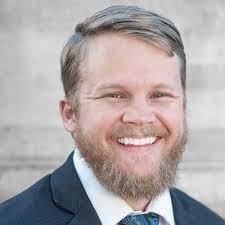 Yuma Investment Group presented Mr. Christopher Franey, teacher at Woodard  Junior High, with his Trip to Hawaii and the framed Yuma Sun “Teacher of  the Year” article for his new classroom that