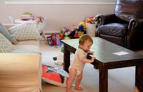 Cute baby boy, playing with toys in a sunny living room, lying down on the sofa. Tips For Toy Storage How To Best Hide Toys In Your Living Room The Chirping Moms