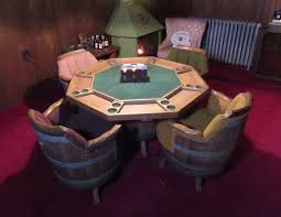 I wonder if you take the glass top off and put wine holders in them while cutting out holes in the sides could make this table have a dual function. Whiskey Barrel Back Swivel Chairs Barrel Base Poker Card Table Sold For My Generation
