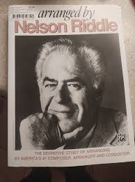 What are some recommended books for film scoring and orchestration?