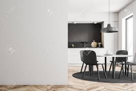 The table is a pedestal round and comes with four chairs. White Round Table With Gray Chairs Standing In Modern Kitchen Stock Photo Picture And Royalty Free Image Image 115169877