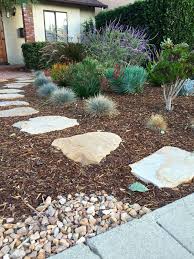 Mulch Makes Your Front Yard Beautiful And Solves Problems Landscaping With Rocks Mulch Landscaping Low Water Landscaping