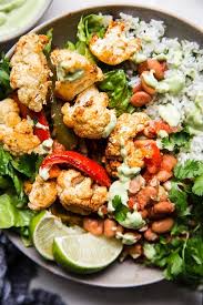 Vegetarian Burrito Bowl With Avocado Crema The Modern Proper Recipe In 2020 Vegetarian Recipes Easy Dinner Vegetarian Burrito Vegetarian Recipes Dinner