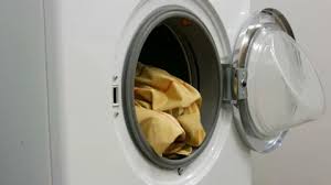 Struggling to understand the fabric care labels? Male Hands Load A Wash Of Colored Laundr Stock Video Pond5