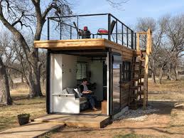 This tiny home with a rooftop deck is made from two shipping containers
