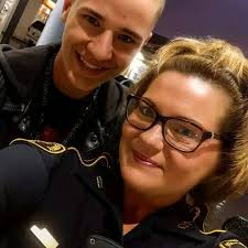 Woman helps family in rain at Walmart