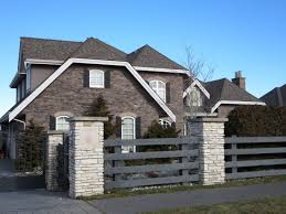 Window frame view isolated on brick house wall. 5 Best Ways To Choose Your Roof Colour Maria Killam