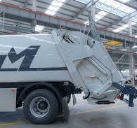 What is a compression garbage truck? What is the use?