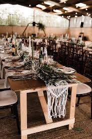 Red, green colors, pine cone centerpieces, candles and reindeer figures. 61 Beautiful Barn Wedding Table Settings Weddingomania