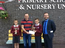 Pat Gallen accepts school Donation for Paula's Run