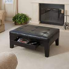 The classic espresso brown leather like upholstery makes this storage bench suitable as a coffee table ottoman in a living room or family room, or as extra seating in a study. Tucson Contemporary Tufted Leather Storage Ottoman Table With Drawer Gdfstudio