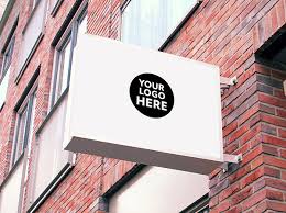 Circular sign mockup placed outside a store. 60 Free Best Outdoor Wall Hanging Mounted Shop Sign Mockup Psd Files