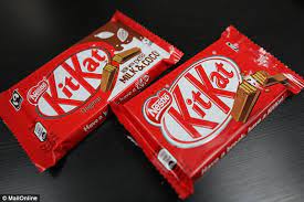 The sayings on the kit kat bars in a scene in office. Public Tests The New Kit Kats With 10 Per Cent Less Sugar Daily Mail Online
