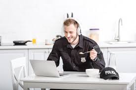 Check spelling or type a new query. Handsome Police Officer Eating Cornflakes And Using Laptop At Kitchen Free Stock Photo And Image