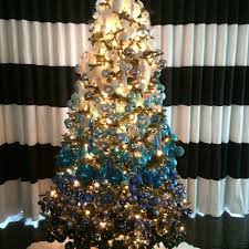 Four large christmas trees decorated in glass ornaments make for a suitably grand display in the white house's grand foyer and cross hall. David Bromstad Peacock Christmas Tree Ombre Christmas Tree Purple Christmas Tree