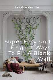 She filled the awkward blank wall on the side of their staircase. Super Easy And Elegant Ways To Fill A Blank Wall Apartment Decorating On A Budget Luxury House Designs Home Decor