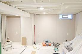 When i was figuring out how to finish a basement i thought to myself self… should we save money and drywall the basement ceiling on our own? then i imagined the difficulty of recruiting my lazy friends to help me drywall the ceiling. Basement Progress White Painted Ceilings And Drywall Is Up Basement Ceiling White Ceiling Basement Ceiling Painted