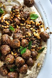 Rich ground lamb and fine grain bulgur wheat are used to form a shell around sauteed beef and earthy pine nuts. Turkish Kofta With Cannellini Puree And Toasted Pine Nuts Lamb Recipes Turkish Recipes Middle Eastern Recipes
