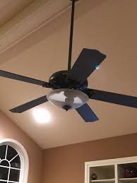 Remove the canopy (decorative plate) covering the point where the fan's down rod connects to the ceiling and tighten the screws holding the fan to the ceiling. Paint Your Ceiling Fan Without Removing It From The Ceiling Painting Ceiling Fans Ceiling Fan Painted Ceiling