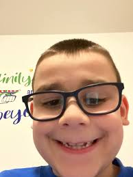 Gabe Brown uses both an eye-controlled computer pad and a simple alphabet  board to discuss his recovery from a severe traumatic brain injury.