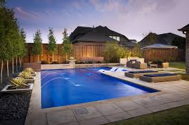 If you are artsy, and have a clear idea for what you want, this style might be best for you. Randy Angell Designs Dallas Outdoor Living Swimming Pool Design
