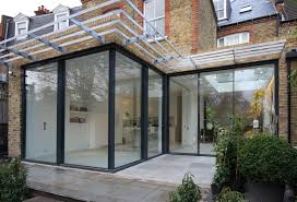 Rear Residential Extension With Minimal Windows Sliding Doors Opening On The Corner By Iq Glass House Extension Design Minimal Windows House Extensions