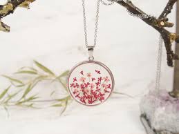 You may need to use a toothpick to carefully arrange the flowers. Handmade Resin Jewelry With Real Flowers