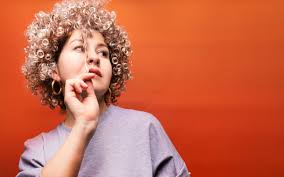 The medium length naturally curly hair in this photo shines thanks to its density, beautiful texture. Simple Go To Hairstyles For Naturally Curly Hair For Filipino Beauties