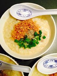 Lugaw Congee Porridge Garnished With Fried Garlic Green Onions And Black Pepper Filipino Chinese Food Food Stuffed Peppers Garlic Fries