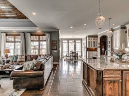 Grey Walls Wood Floors White Trim And Brown Leather Sectional And Accents Grey Walls Living Room Living Room Wood Floor Gray Living Room Walls Brown Couch